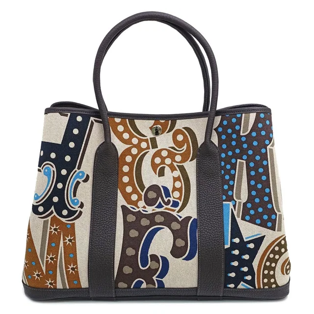 Hermès Garden Party ―Pm Electric Handbag Around Toile H Plume Negonda in Canvas from The Reluxe