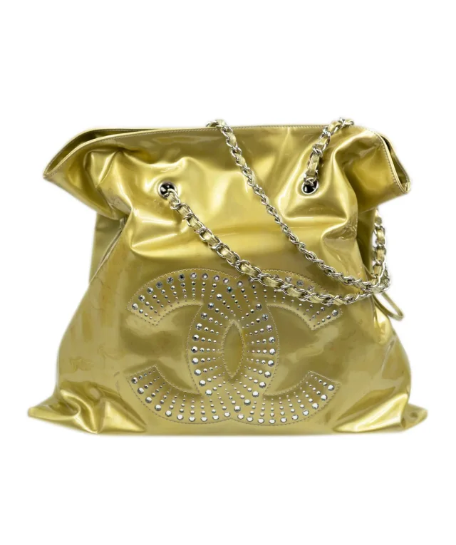 Chanel vinyl gold tote bag with large CC logo crystal diamante detailing. in Gold from Luxury Promise