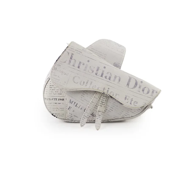 Christina Dior x Daniel Arsham Men's Newspaper Print Saddle Bag White in White Leather from The Purse Affair