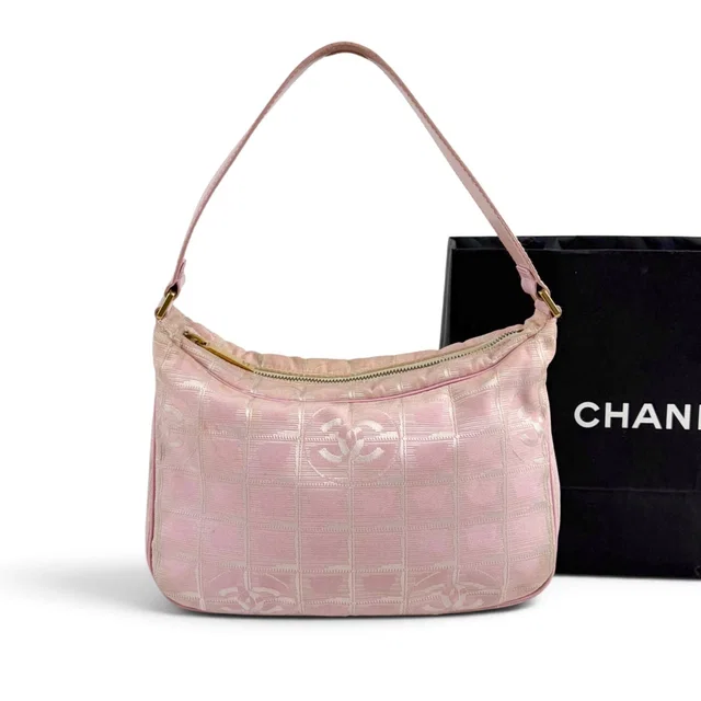 Chanel New Travel Line Hand Pink Mini Handbag Pouch Nylon Canvas CC Logo in Pink Canvas from The Reluxe