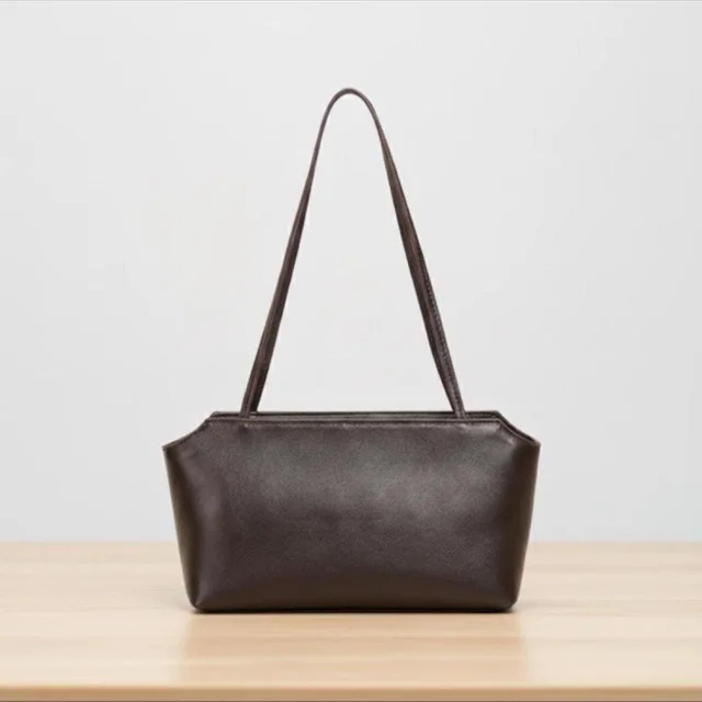 The Row Women's Shoulder bags - Brown in brown|red from Depop, photo 1 of 1