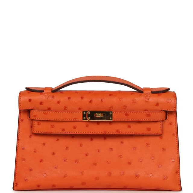 Hermès Kelly Pochette Tangerine Ostrich Gold Hardware in Ostrich from Madison Avenue Couture