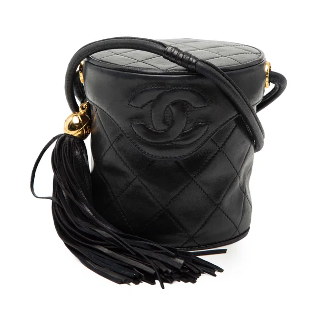 Black Chanel Mini Quilted Lambskin Canteen Tassel Vanity Case in Black Lambskin from Designer Revival