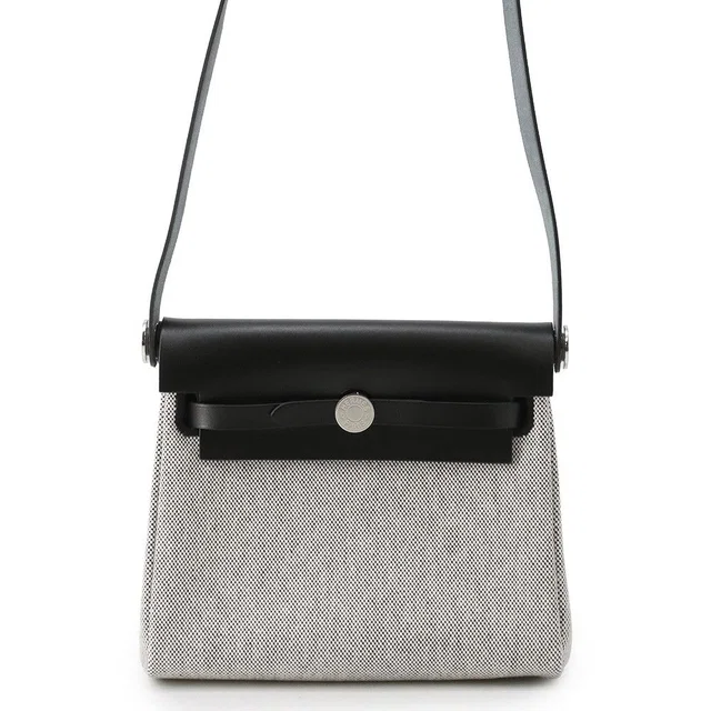 Hermès Shoulder Bag Herbag Zip Mini Ecru Black Silver Toile H Vache Hunter in Black from The Reluxe