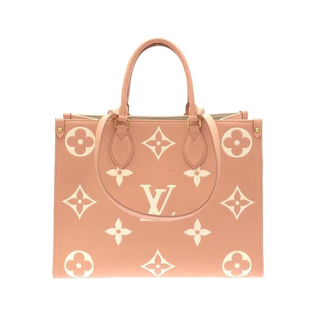 Louis Vuitton Bicolor Monogram Empreinte On The Go MM Bag from The Reluxe