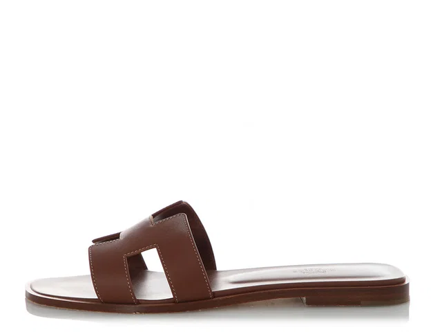 Hermès Gold Calfskin Oran Sandals in Gold Calfskin from Ann's Fabulous Finds