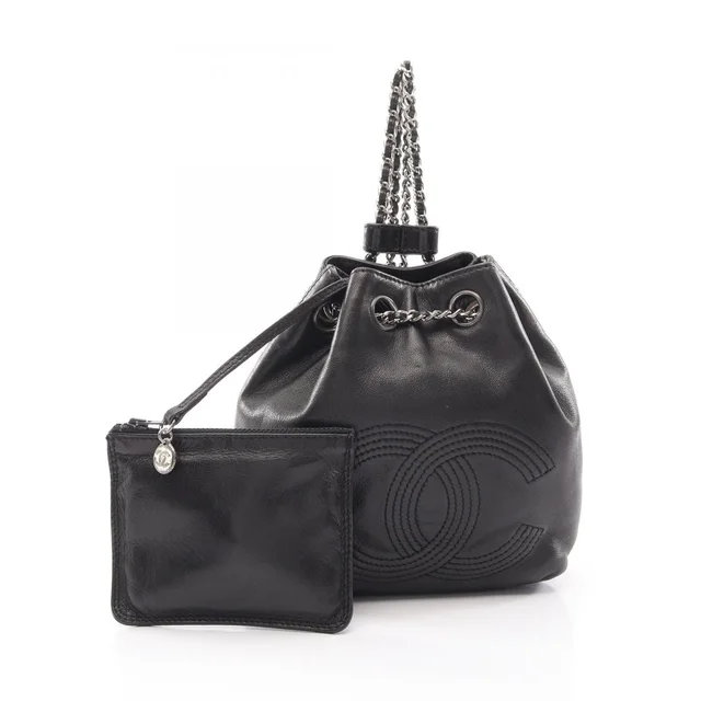 Chanel Backpack CC Logo Small Drawstring Black Lambskin CC Chain in Black Lambskin from The Reluxe