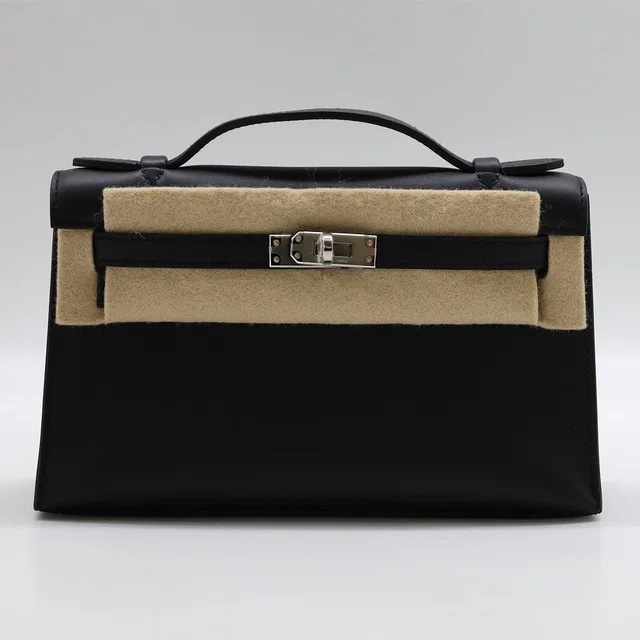 Hermès Kelly pochette Black Swift PHW K in Black Swift leather from Luxury Promise