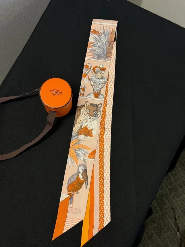 Hermès Twilly - Orange Animal Print in Orange Silk from Luxury Promise