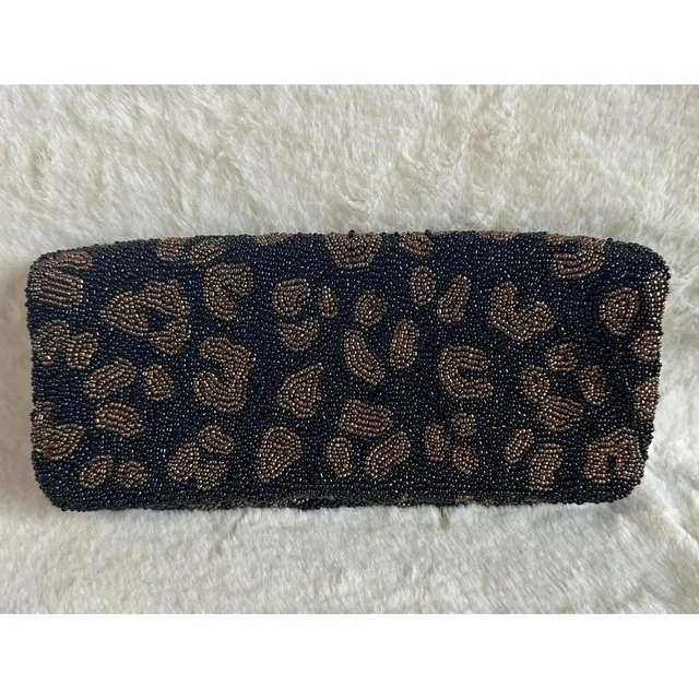 Moynat Women's Clutch bags - Black in black from Depop, photo 1 of 1