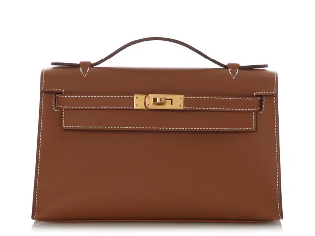 Hermès Gold Swift Kelly Pochette in Gold Swift leather from Ann's Fabulous Finds