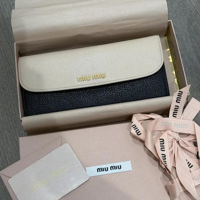 Miu Miu Women's Wallets - Black/Cream in black from Depop, photo 1 of 1