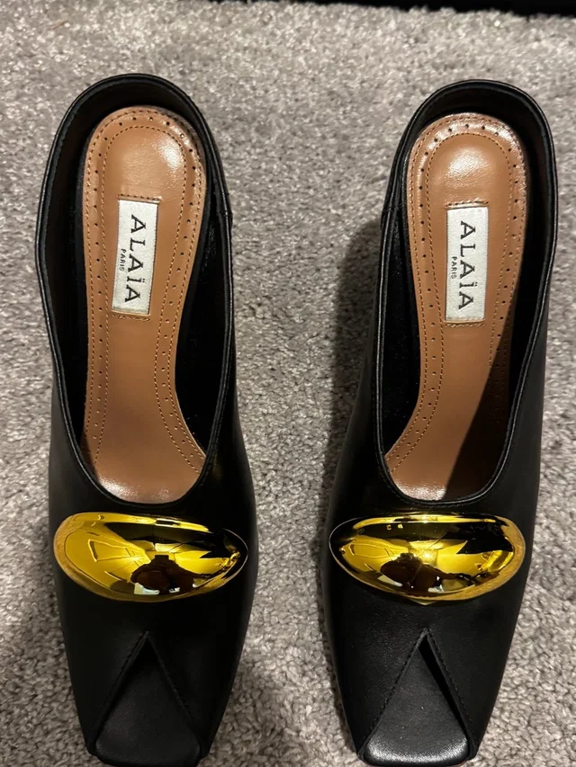 Alaïa Black Leather Mules With Gold Accent in black|gold Leather from Poshmark, photo 1 of 1