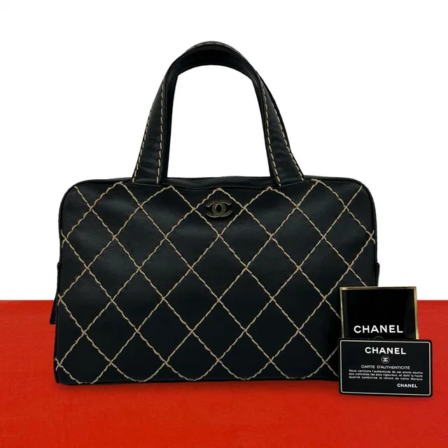 Chanel CC Logo Wild Stitch Leather Mini Boston Bag Black in Black Leather from The Reluxe