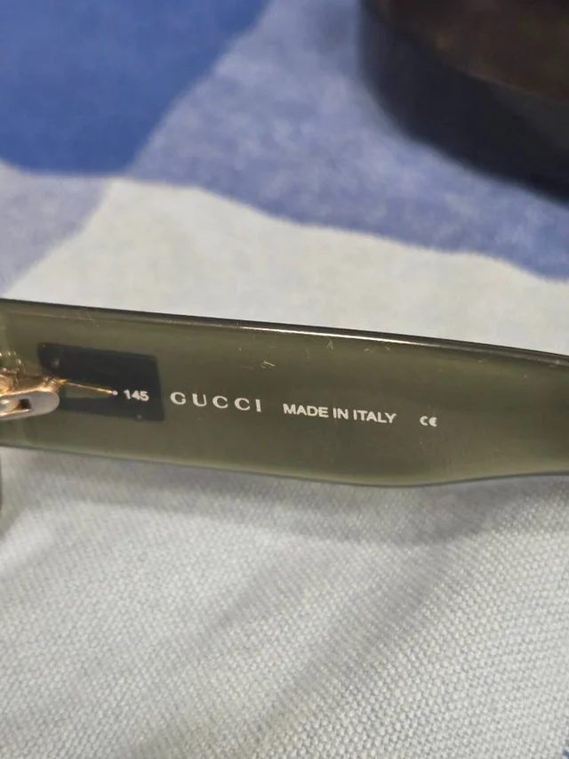 Gucci Sun glasses in Green from Oxfam Online Shop, photo 2 of 3