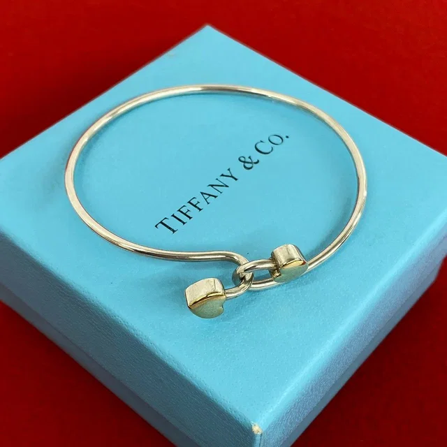 Tiffany & Co. Vintage Solid Double Heart Hook Bangle Silver Gold Bracelet in Gold from The Reluxe