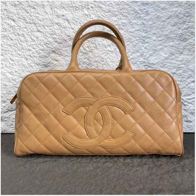 Chanel Quilted CC Boston Bowling Bag in Beige Caviar leather from Luxury Promise, photo 1 of 1