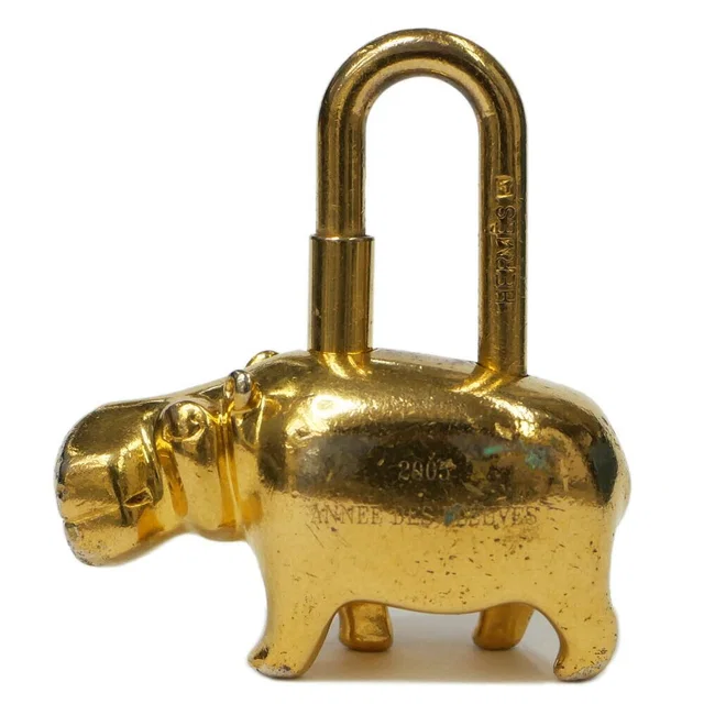 Hermès Cadena Cabas Limited Gold Annee Des Fleuves Lock Charm Keychain in Gold from The Reluxe