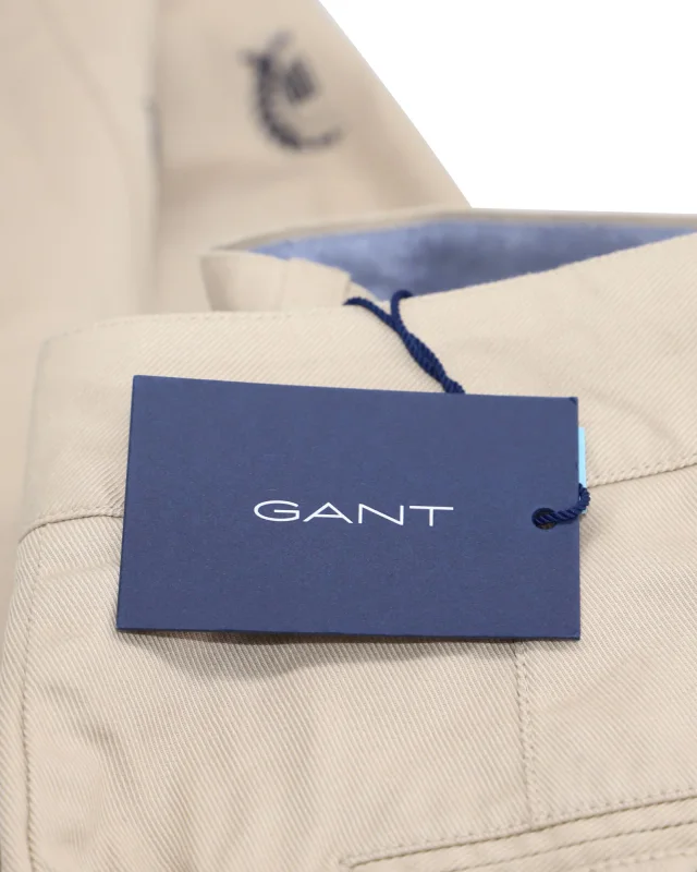 Gant High-Waisted Crest Embroidery Pleated Chinos in Beige Print Cotton in Beige, photo 4 of 6 from ShopSimon