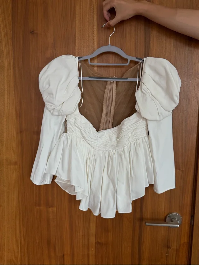 Khaite Kim Top Ivory Puff-Sleeve Peplum Blouse in White from Poshmark