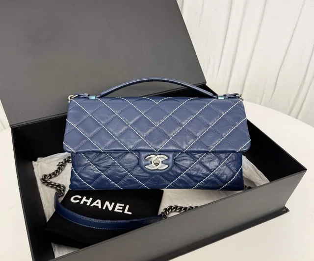 Chanel blue calfskin leather chain bag with external stitching (23mm opening, no card) 27 in Blue Calfskin from Luxury Promise