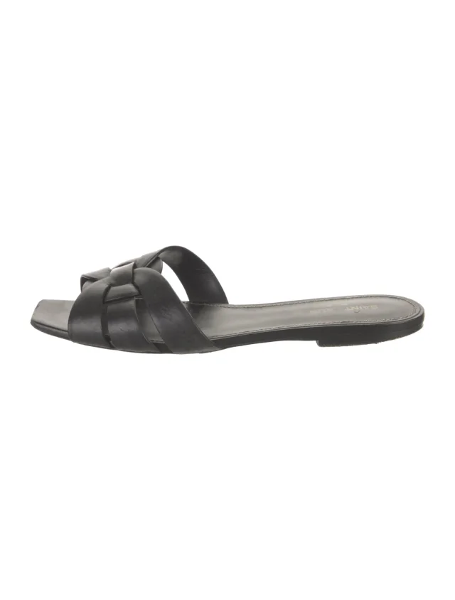 Saint Laurent Leather Slides in black Leather from The RealReal