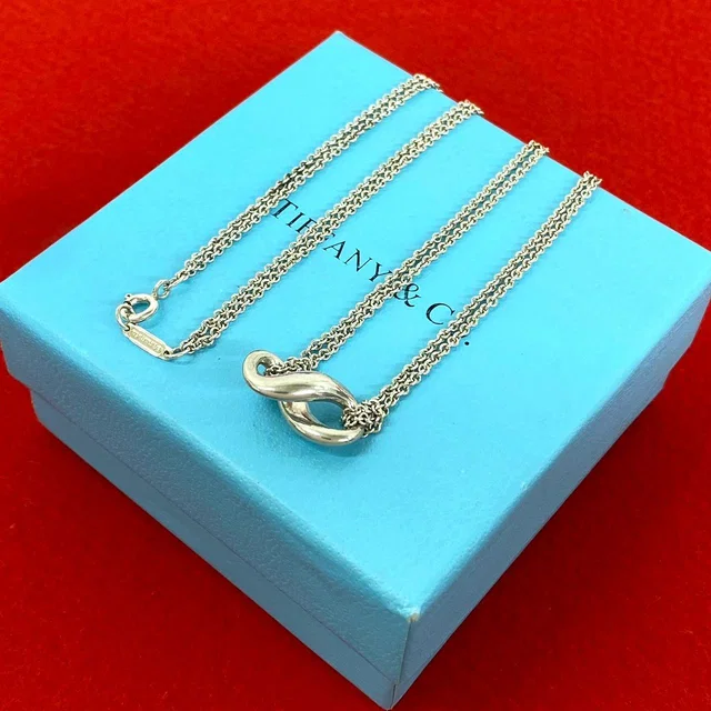 Tiffany & Co. Vintage Infinity Necklace 925 Sterling Silver Pendant in Silver from The Reluxe