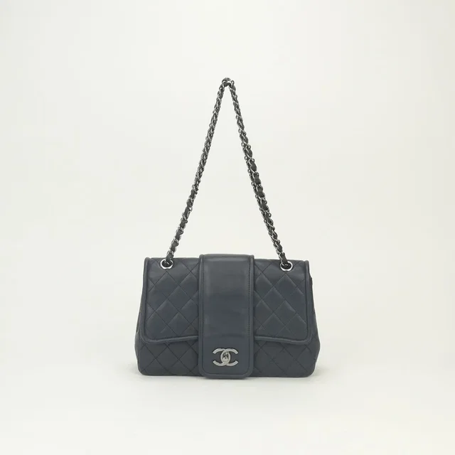 Chanel Quilted Shoulder Bag Lambskin Navy Blue Silver Double Chain S Flap CC in Navy Lambskin from The Reluxe