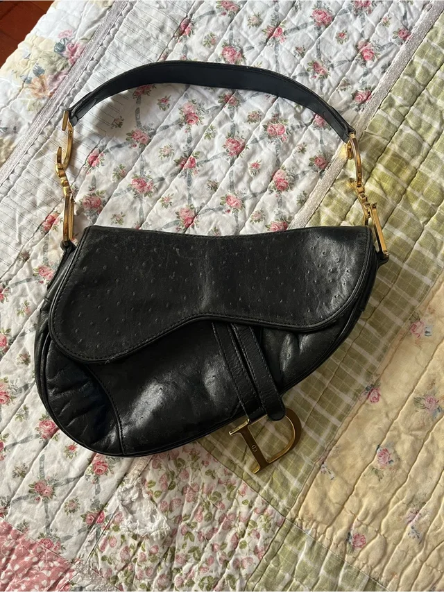 Dior Black Saddle Shoulder Bag in black|gold Ostrich from Poshmark, photo 1 of 1