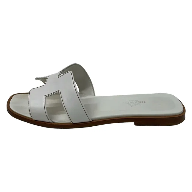 Hermès Mules Oran White Leather in White Leather from The Reluxe