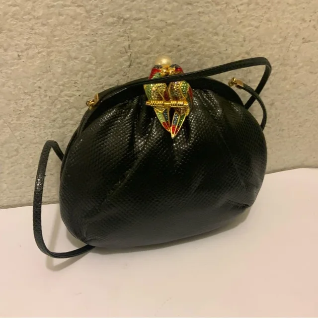 Judith Leiber Skin & Crystal Parrot Clasp Minaudiere Purse / Bag in black Lizard from Poshmark, photo 1 of 1