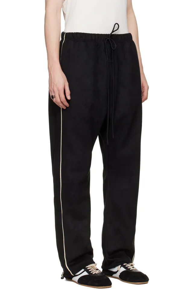 Fear of God ESSENTIALS Black Signature Relaxed Track Pants, photo 2 of 4 from SSENSE