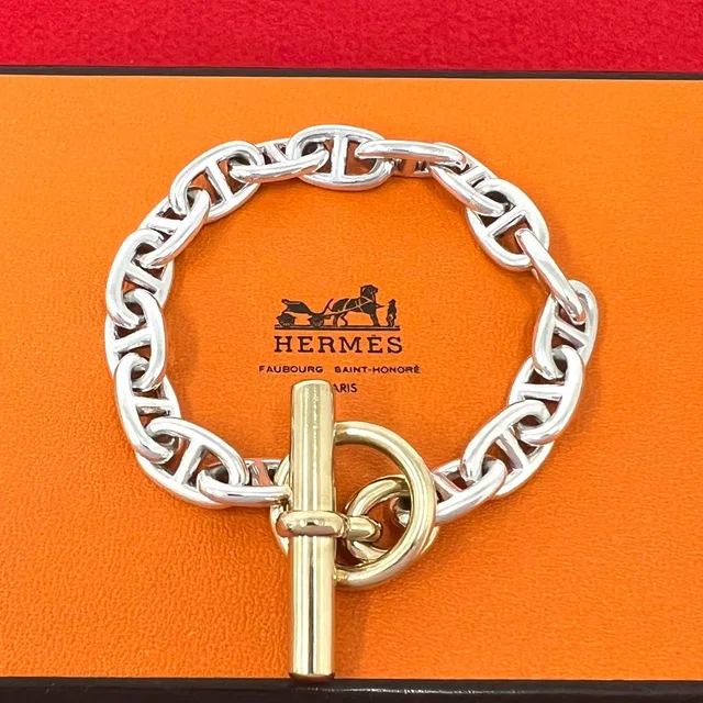 Hermès Vintage Patine MM 17 Links Bracelet Cursive Logo Silver Gold in Gold from The Reluxe