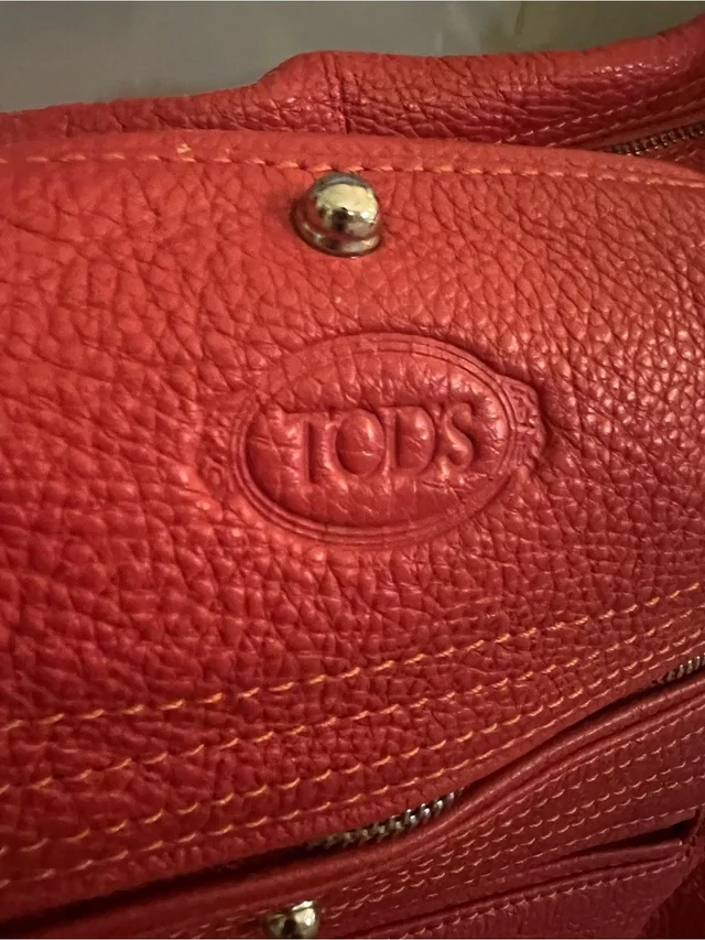 Tod's Orange Red Pebbled Leather Shoulder Bag With Embossed Logo in red Leather from Poshmark