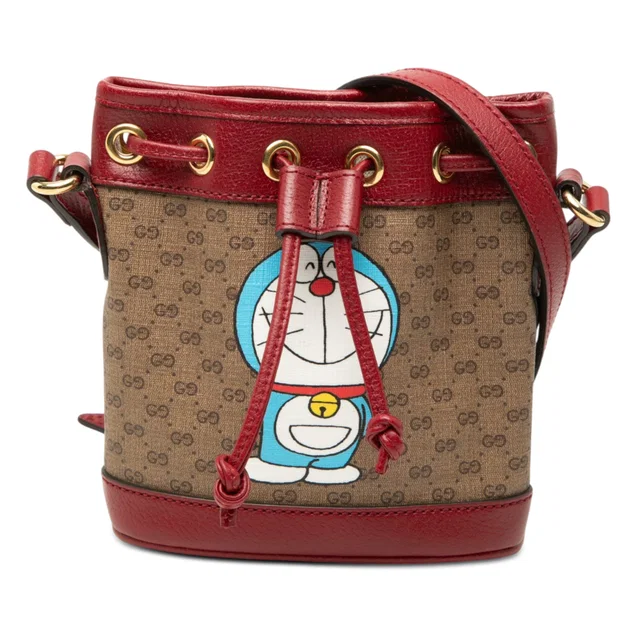 Beige Gucci Micro GG Supreme Doraemon Bucket Bag in Beige Coated canvas from Designer Revival