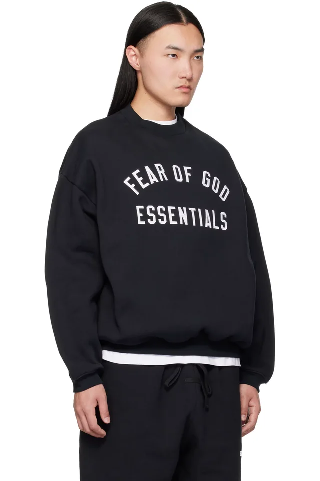 Fear of God ESSENTIALS Black Varsity 90s Crewneck Sweatshirt, photo 2 of 4 from SSENSE