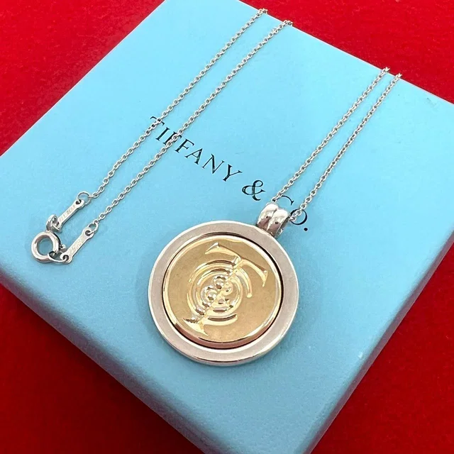 Tiffany & Co. Coin Necklace Silver Yellow Gold in Yellow from The Reluxe