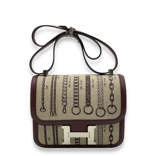 Hermès Constance Toile de Camp Dechainee 24 Bordeaux in Burgundy Swift leather from LuxLexicon