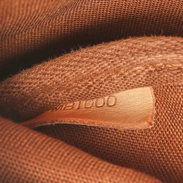 Louis Vuitton Monogram Saumur 30 Bag in Coated canvas from A Retro Tale, photo 9 of 10