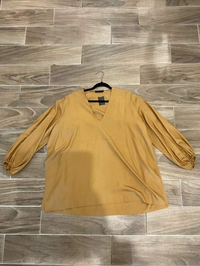 The Row blouses in gold from Poshmark