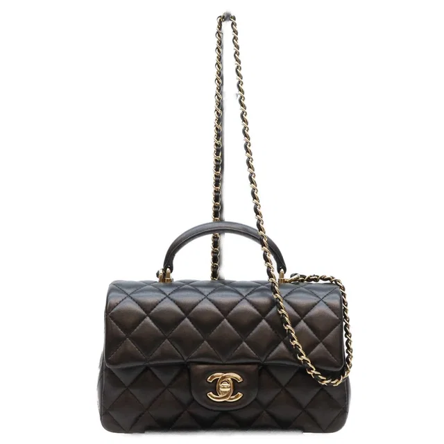 Chanel Top Handle Mini Quilted 20 in Black Lambskin from The Reluxe