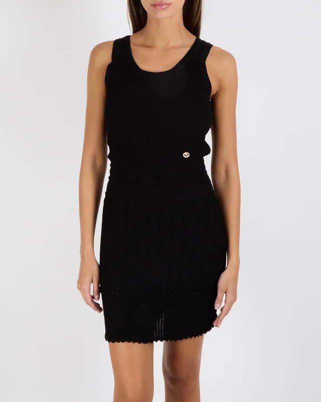 Chanel Vintage 07P Black Knit Ribbed Sleeveless Mini Dress with Pleated Skirt and Gold and Black CC… in Black from Sellier