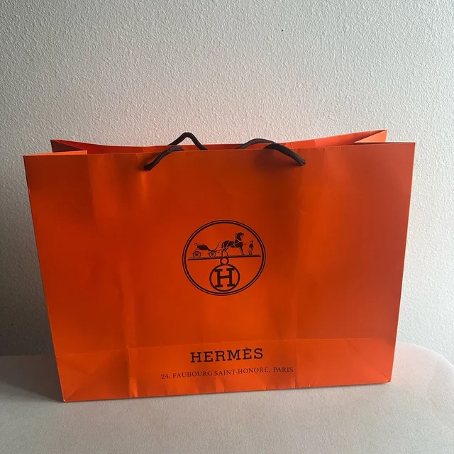 Hermès Herms Orange Paper Shopping Bag With Black Logo in orange|black from Poshmark