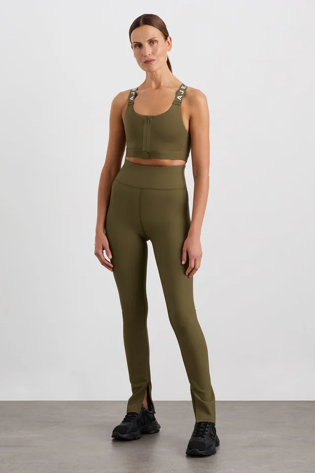 Athletica Zip Hem Full Length Legging 205 in Beige from Aje, photo 1 of 1
