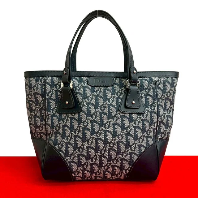 Dior Trotter Pattern CD Logo Canvas Leather in Canvas from The Reluxe