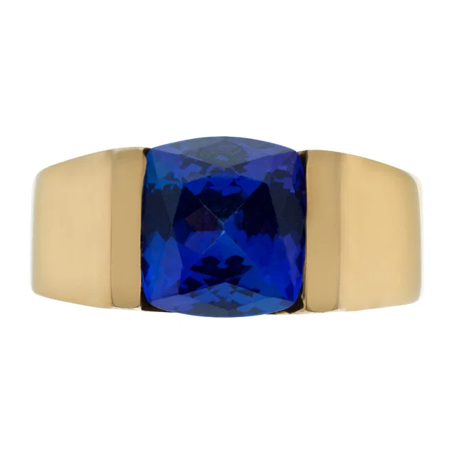 Chanel set cushion cut faceted blue/purple tanzanite in an 18k gold tension setting in Blue Yellow Gold from Gray And Sons