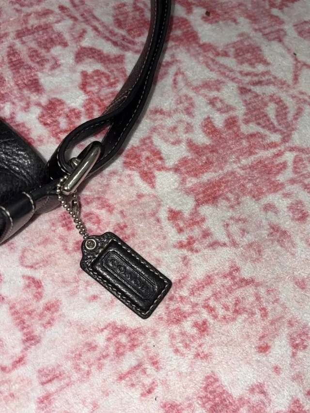 Coach Wristlet Strap With Logo Tag Charm in black Leather from Poshmark