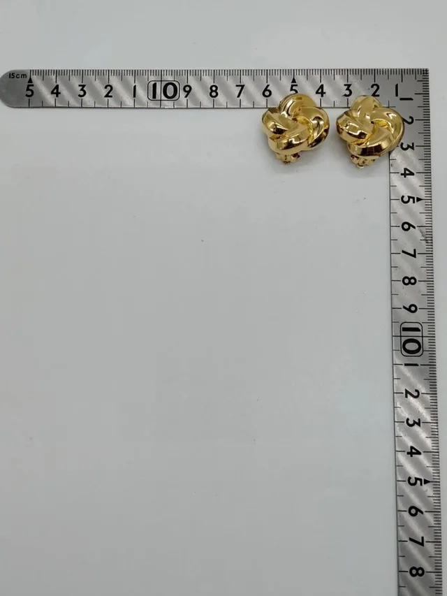 Givenchy Vintage Gold Tone Knot Clip-On Earrings Statement Designer Jewelry in gold from Poshmark, photo 5 of 10