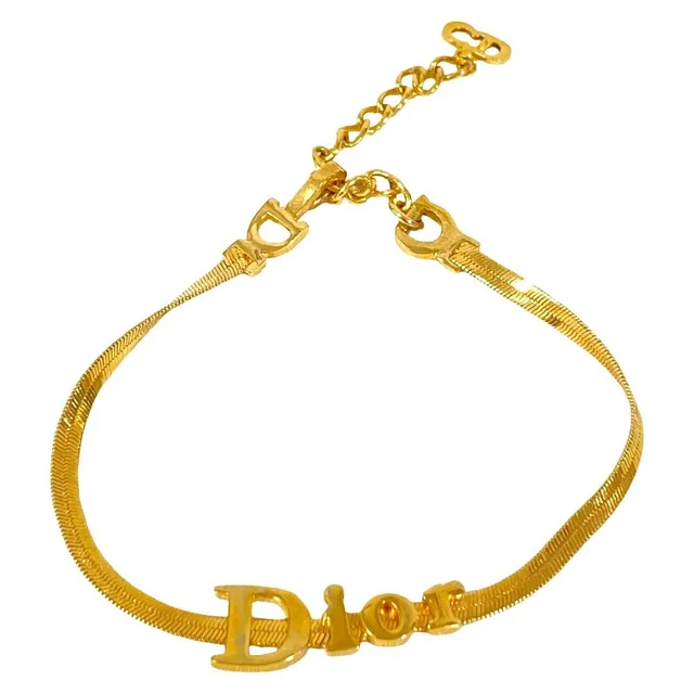 Dior Vintage Logo Bracelet Gold Plated in Gold from The Reluxe