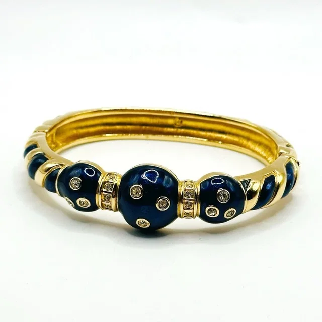 Swarovski 1990's Navy And Gold Classic Hinged Bangle Bracelet With Rhinestones in gold from Poshmark